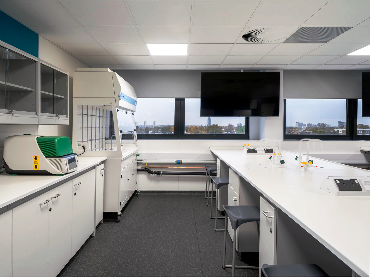 Laboratory furniture, ducted mobile fume cupboard with view of London.