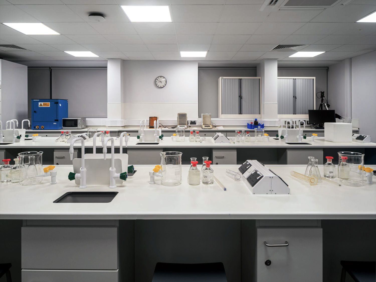 Laboratory islands with glassware in high specification laboratory environment.
